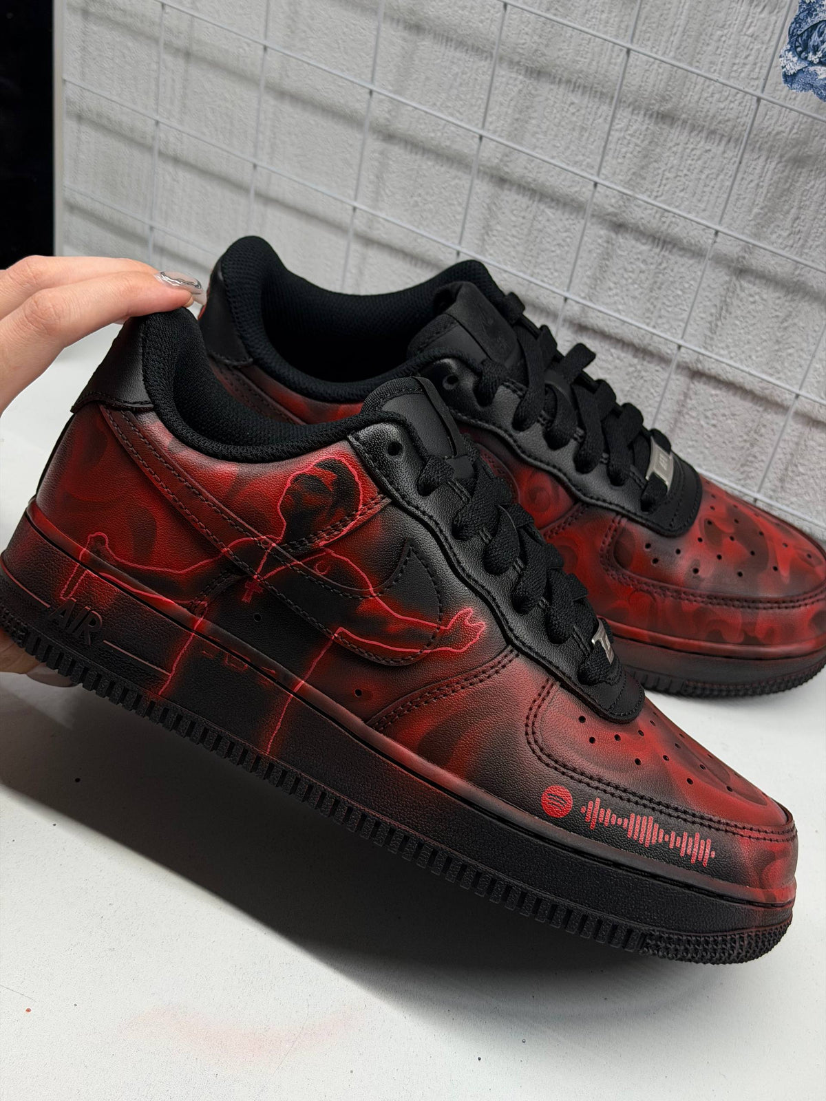 Custom Air Force 1 with a hand-painted artist design and a scannable Spotify code